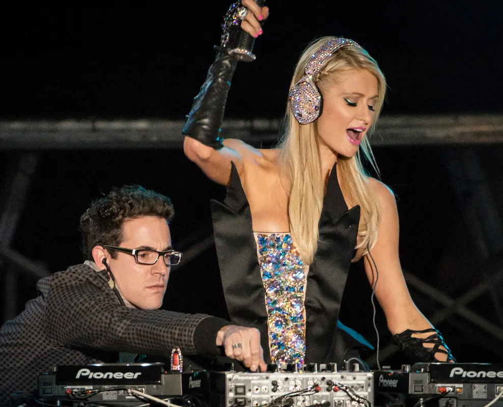 Why do DJs constantly twist the knobs of the mixer?